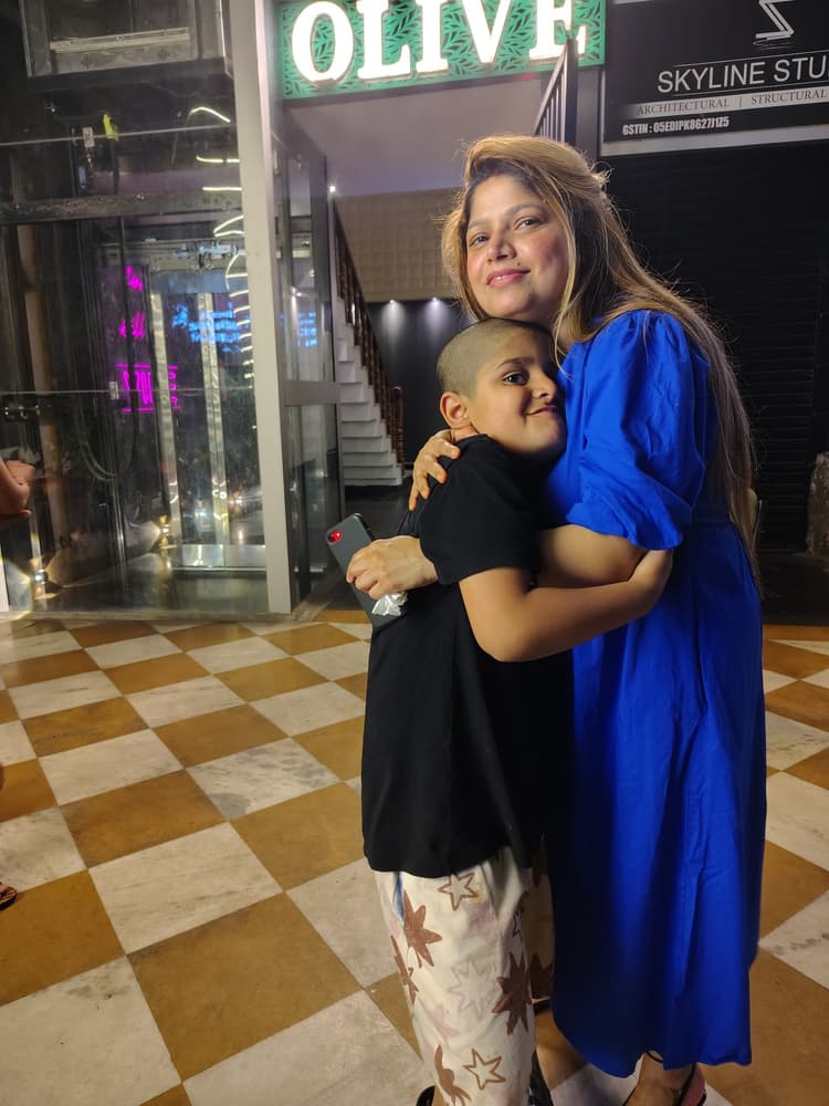 Vyom giving his mother a loving and affectionate warm hug with a sweet smile
